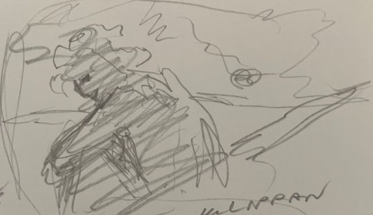 Crouching on a rock cliff